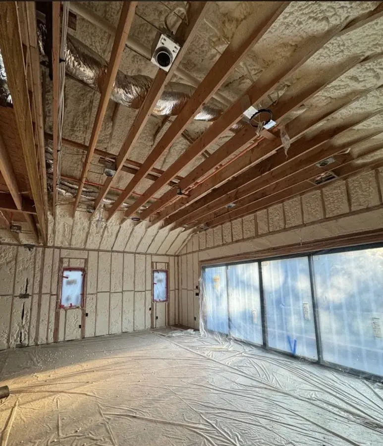 Interior walls and ceiling insulated with spray foam during new construction in Upper Makefield